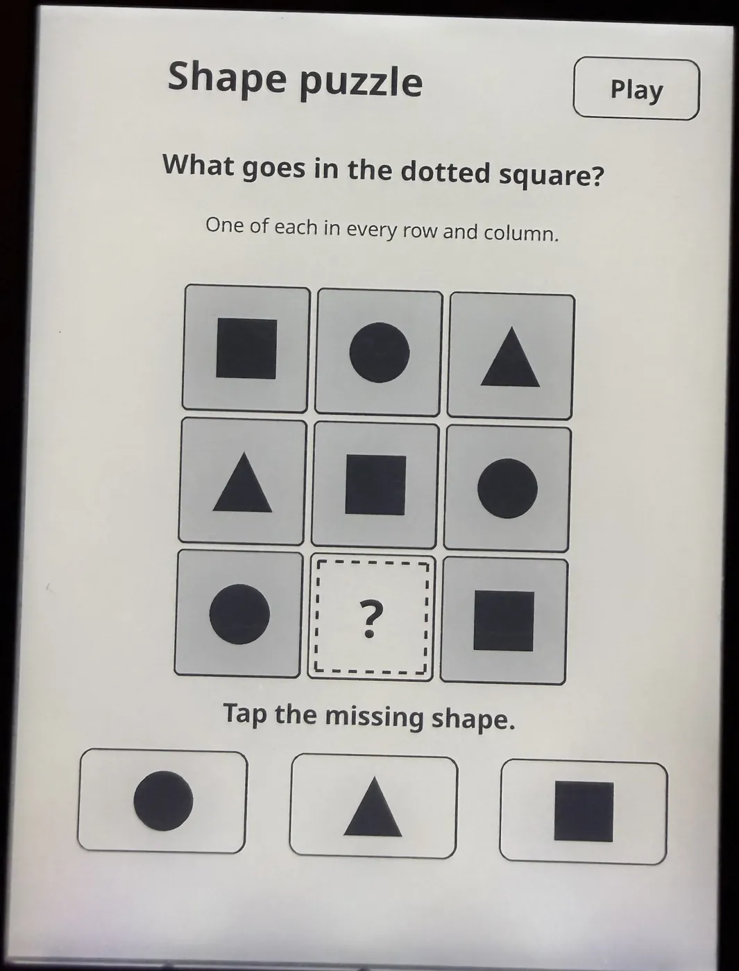 Shape puzzle: a 3 by 3 grid of circles, squares and triangles with one dotted square to fill