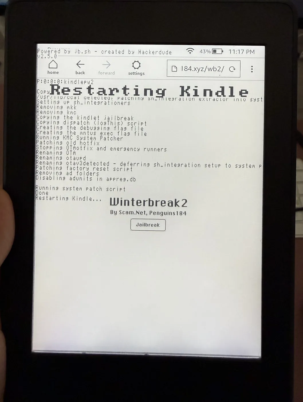 Kindle screen showing the Winterbreak2 jailbreak log and Restarting Kindle