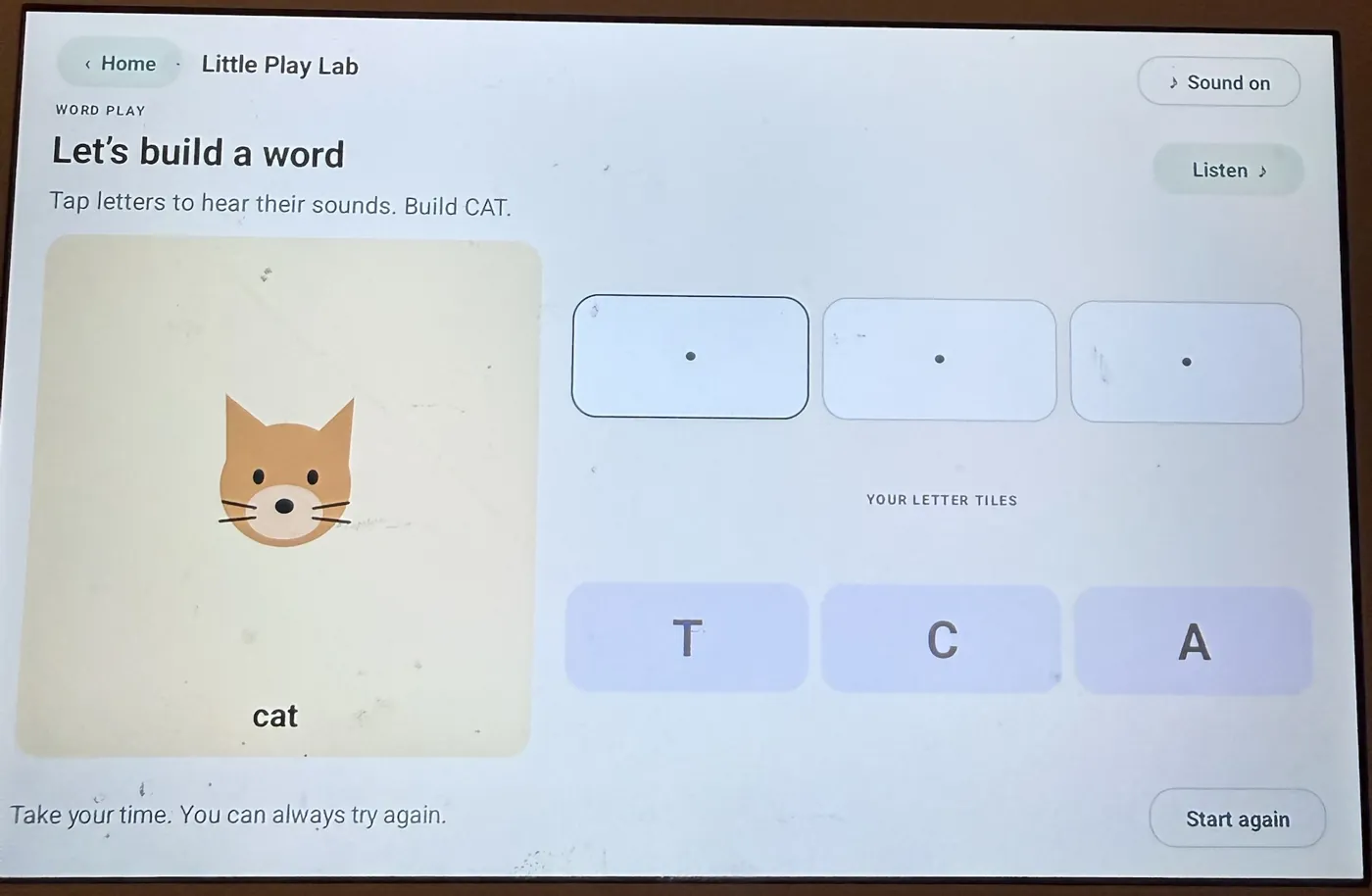 Build a word game: a cat picture with letter tiles T, C and A