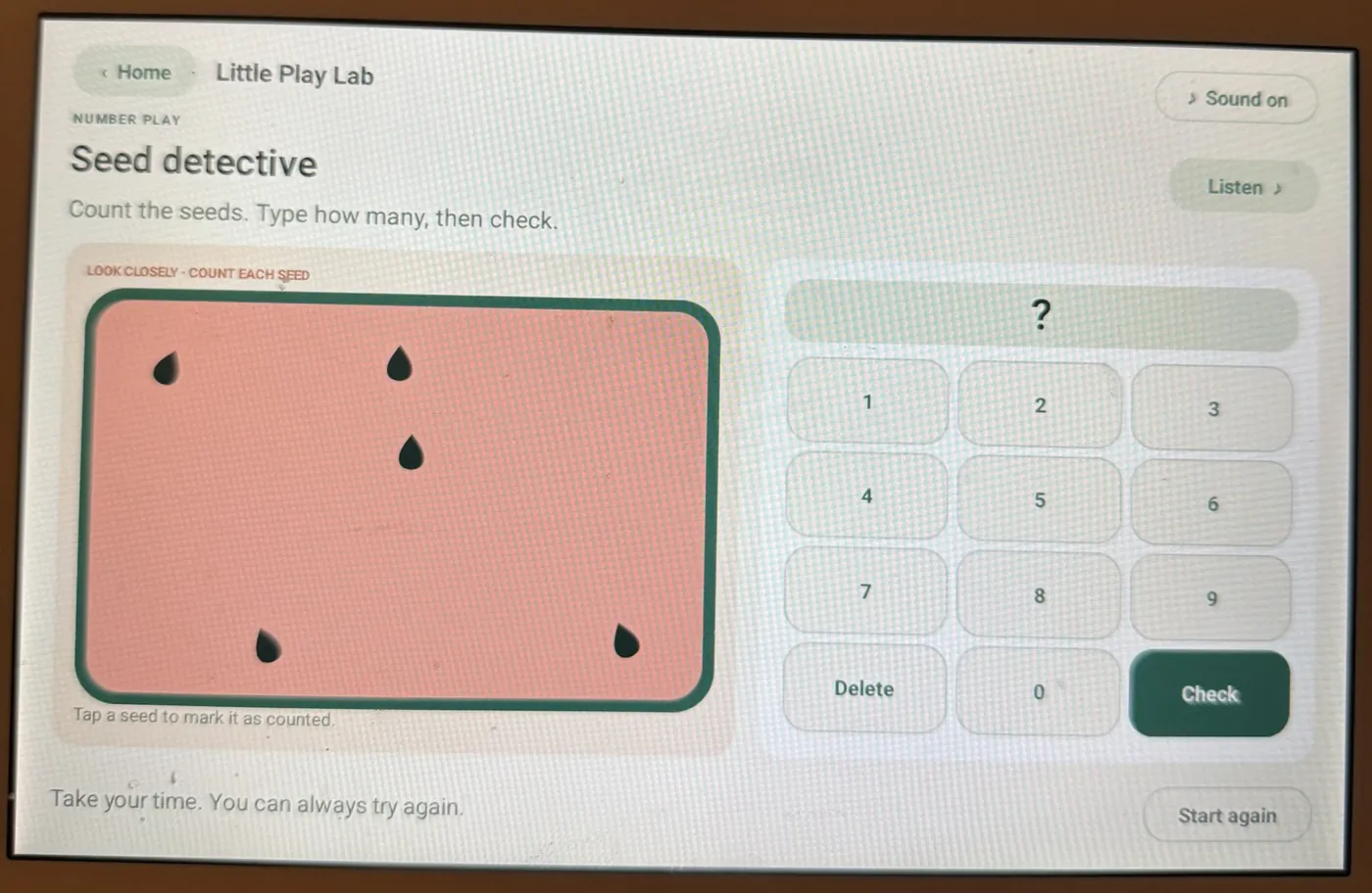 Seed detective game: a watermelon slice with five seeds next to a number pad